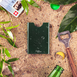 Pine Tree Thin King credit card case on a sandy beach 